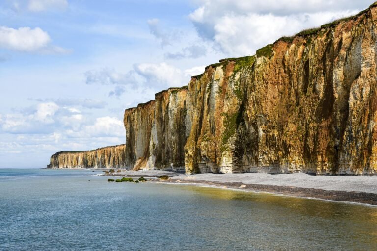Stunning view of the iconic cliffs of Étretat, Normandy, showcasing natural beauty and dramatic scenery.